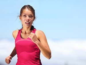 photo of a woman running outdoors