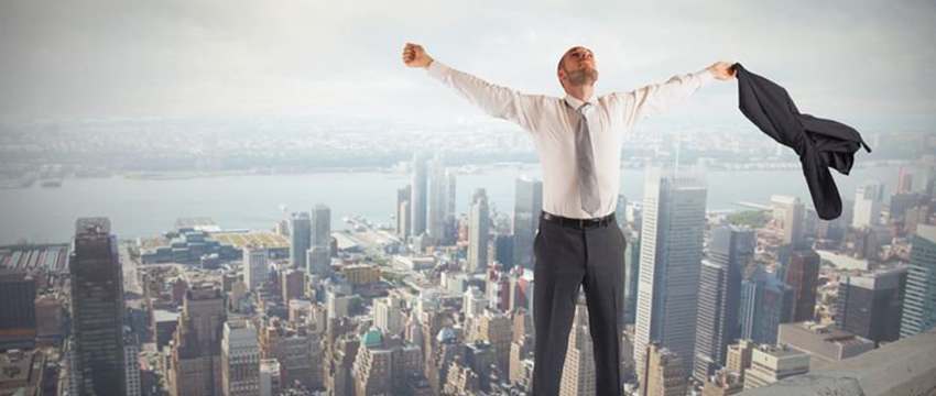 man feeling relief on top of a building