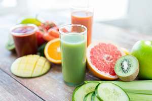 photo of different fruits and glasses of smoothie