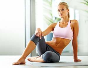 woman sitting on a yoga mat