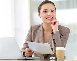 photo of a happy woman in the office