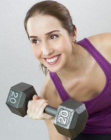 Smiling Woman Holding Dumbbell