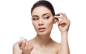 Woman Applying Facial Serum